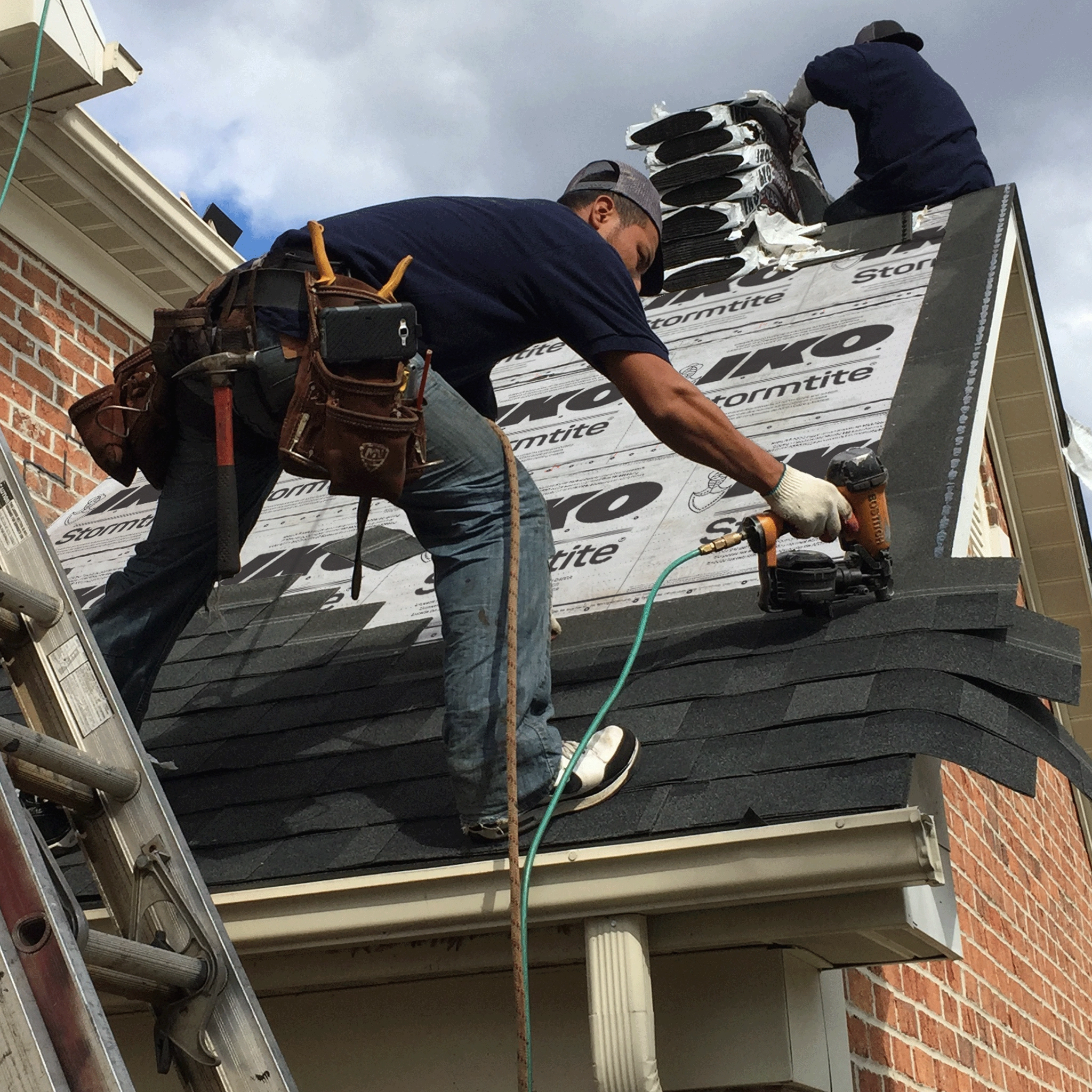 Residential Roofers in Regina Roofcat Roofing Residential Roofer on roof installing asphalt shinghles.